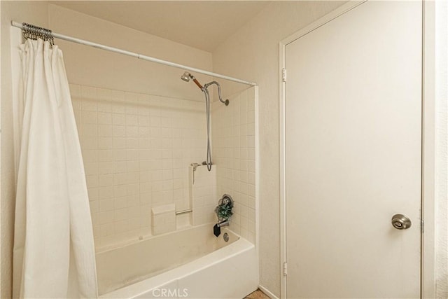 bathroom with shower / bath combination with curtain