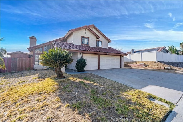 front facade with a front yard and a garage