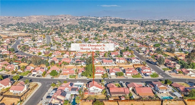 birds eye view of property featuring a mountain view