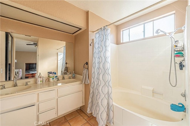 bathroom with tile patterned flooring, vanity, ceiling fan, and shower / bath combo