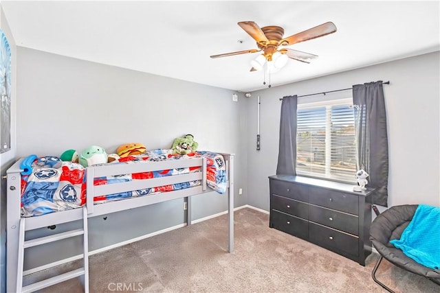 bedroom with ceiling fan and carpet floors