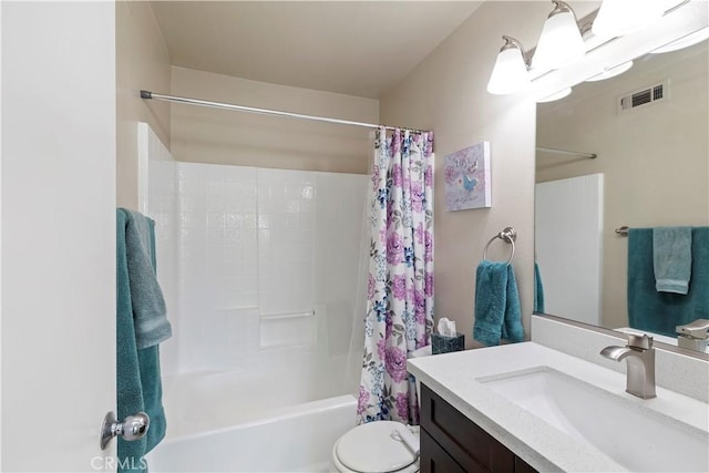 full bathroom featuring toilet, vanity, and shower / tub combo with curtain