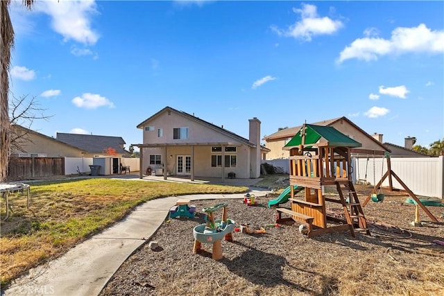 view of jungle gym featuring a patio, french doors, and a trampoline