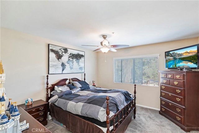 bedroom featuring ceiling fan and light carpet