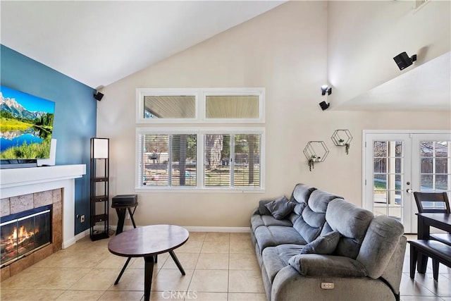 tiled living room featuring french doors, a fireplace, and vaulted ceiling