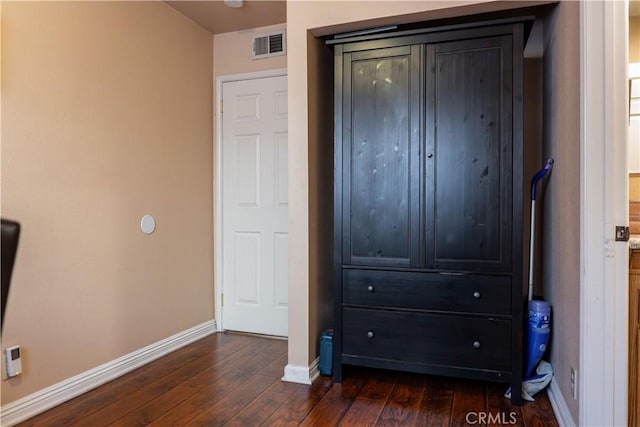 bedroom featuring dark wood-type flooring