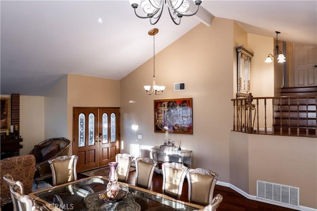 dining space featuring vaulted ceiling with beams, dark hardwood / wood-style flooring, and an inviting chandelier