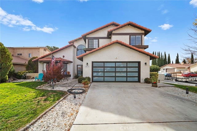 view of front facade with a garage and a front yard