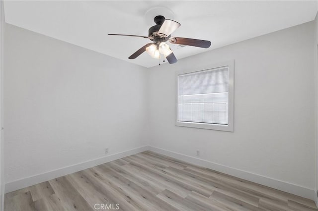 spare room with light hardwood / wood-style flooring and ceiling fan