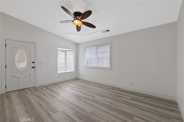 foyer featuring ceiling fan, light hardwood / wood-style flooring, and vaulted ceiling