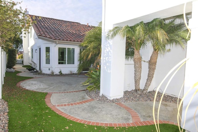 exterior space featuring a yard and a patio