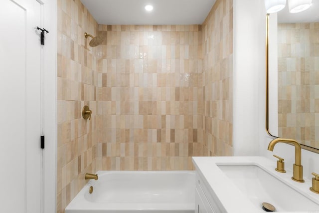 bathroom featuring shower / washtub combination and vanity