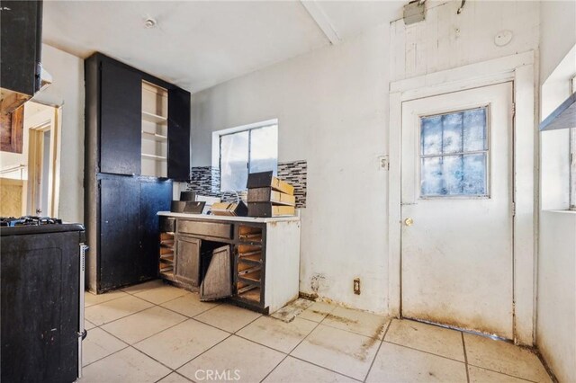 kitchen with light tile patterned floors