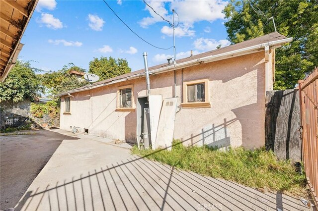 back of property with a patio