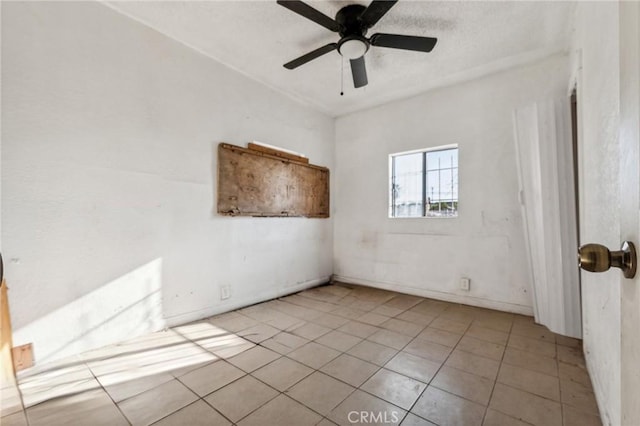 2853 E 6th St, Los Angeles, CA 90023 - tiled empty room featuring a ceiling fan and baseboards
