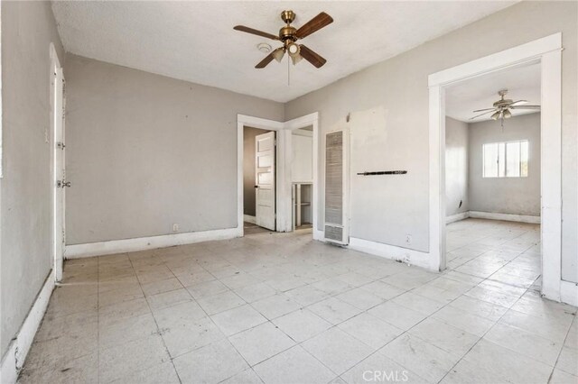 unfurnished room with ceiling fan