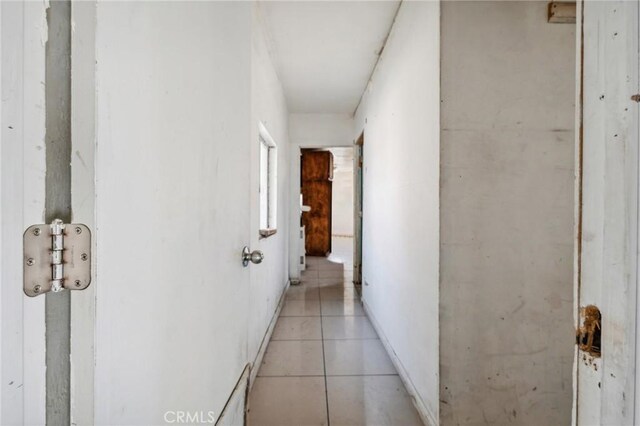 corridor with light tile patterned floors