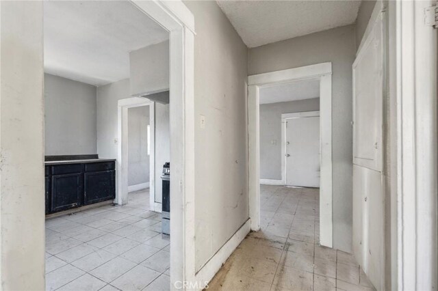 hallway with light tile patterned flooring
