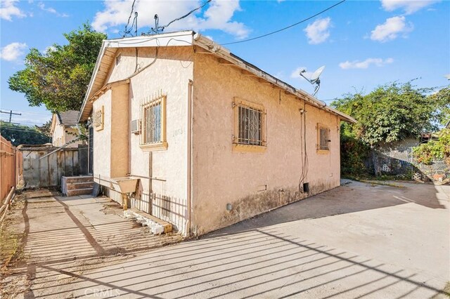 view of side of home featuring a patio