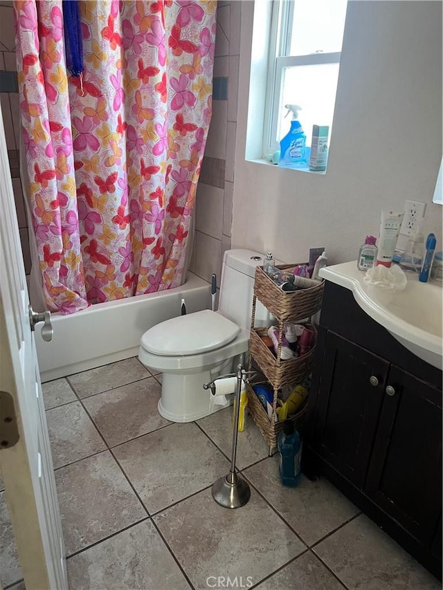 full bathroom featuring shower / tub combo, vanity, toilet, and tile patterned floors