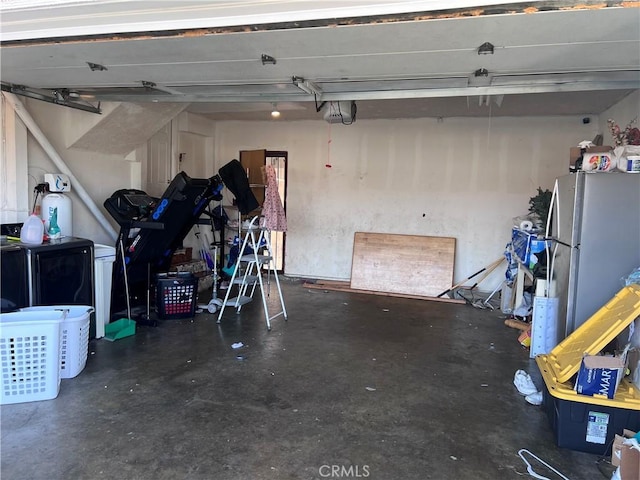 garage with stainless steel fridge