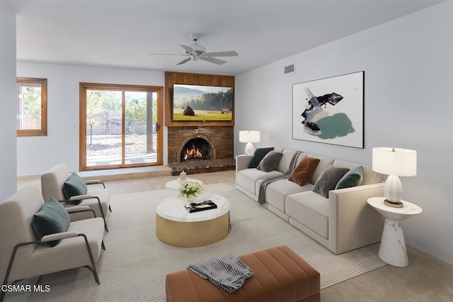 carpeted living room featuring ceiling fan and a brick fireplace