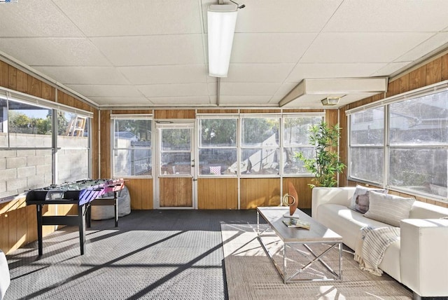 sunroom / solarium featuring a drop ceiling