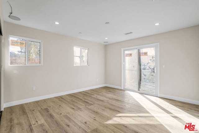 empty room featuring light hardwood / wood-style floors