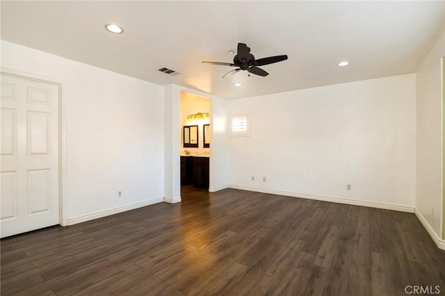 unfurnished living room featuring dark hardwood / wood-style flooring and ceiling fan