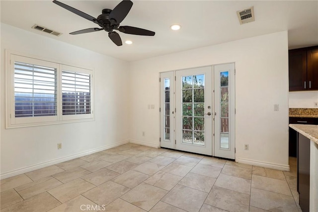 doorway with ceiling fan and light tile patterned flooring