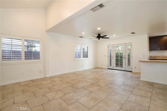 unfurnished living room featuring ceiling fan