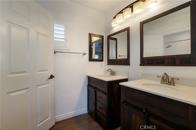 bathroom featuring vanity and wood-type flooring