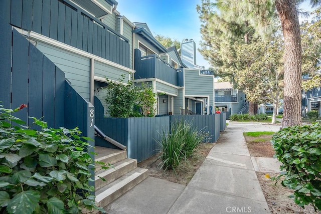 7340 Quill Dr Unit 81, Downey, CA 90242 - view of property exterior featuring board and batten siding