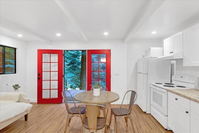 dining room featuring beam ceiling, light hardwood / wood-style flooring, and french doors