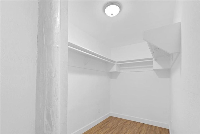 walk in closet featuring hardwood / wood-style floors