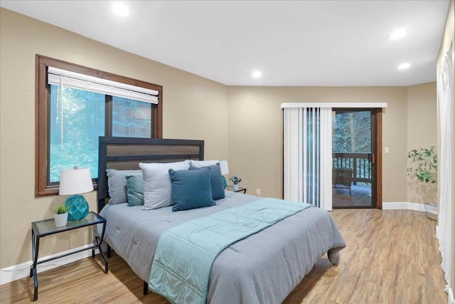 bedroom featuring access to outside and light wood-type flooring