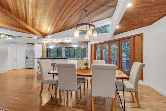 dining room featuring french doors, wooden ceiling, vaulted ceiling, and light hardwood / wood-style floors