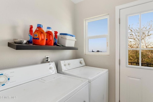 washroom with washing machine and clothes dryer