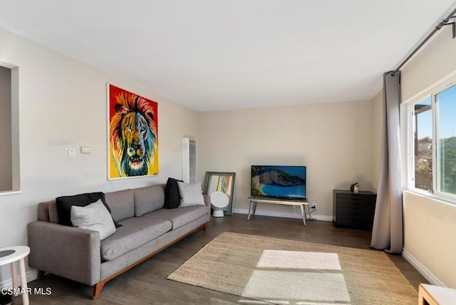 living room with dark hardwood / wood-style flooring