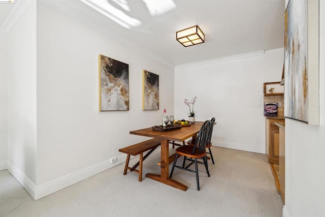 dining area with crown molding