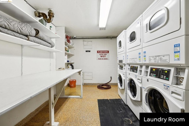 washroom with washing machine and clothes dryer and stacked washer / dryer