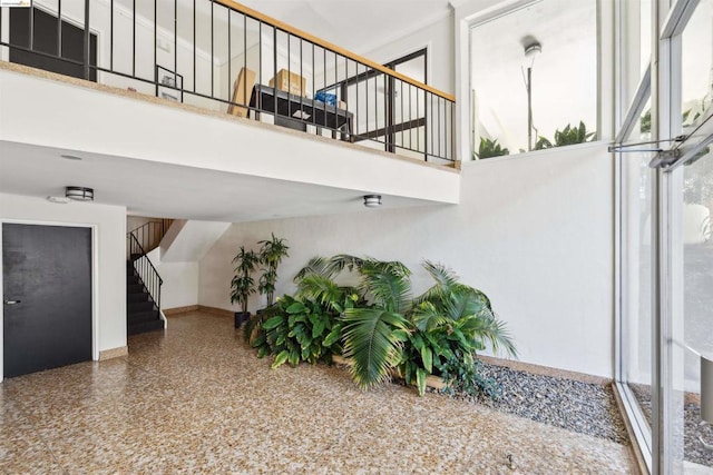 interior space featuring a towering ceiling