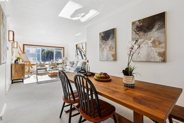 view of carpeted dining space