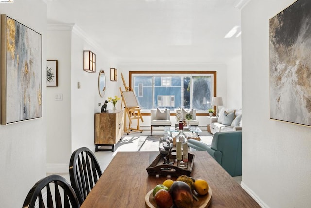 dining area featuring crown molding