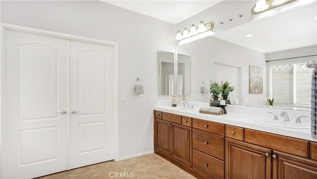 bathroom with vanity and tile patterned floors