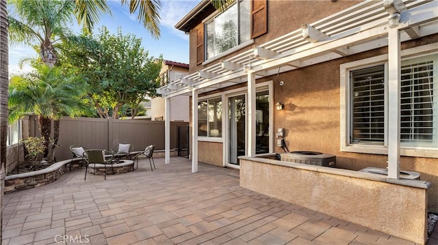 view of patio / terrace with a pergola and an outdoor fire pit