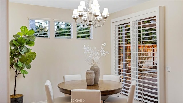 dining space with a chandelier