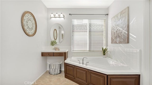 bathroom featuring a washtub, vanity, and tile patterned flooring