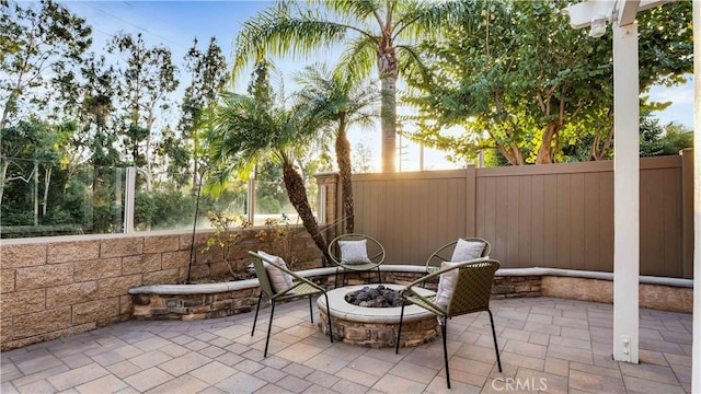 view of patio with a fire pit