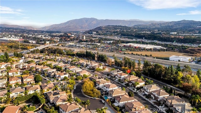 birds eye view of property featuring a mountain view